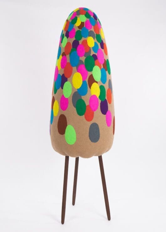 Masako Miki, Karakasa Obake (straw umbrella shapeshifter), 2022. Wool on EPS foam, walnut wood. 78 x 24 inches (198.1 x 61 cm)